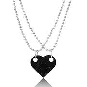 Black heart-shaped acrylic necklace with a silver chain, offering a bold and modern Valentine's Day gift.