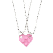 Pink heart-shaped acrylic necklace with a silver chain, a charming and romantic gift for Valentine's Day.