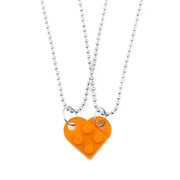 Orange heart-shaped acrylic necklace with a silver chain, a bright and unique Valentine's Day gift idea.